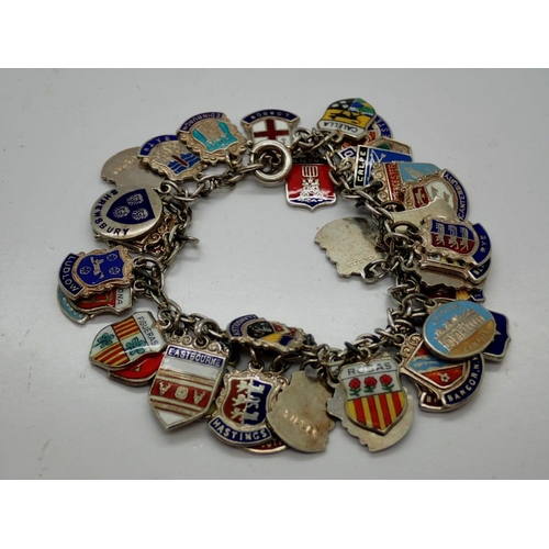 97 - Silver charm bracelet with forty enamelled charms, L: 18 cm. UK P&P Group 0 (£6+VAT for the first lo... 