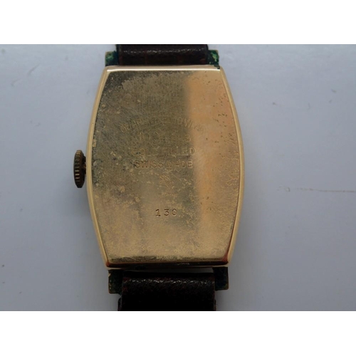 152 - Gents Swiss made 15 jewel wristwatch in a gold filled case with subsidiary seconds dial on a brown l... 