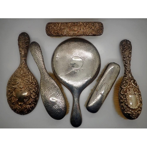 175 - Four hallmarked silver backed brushes and two hallmarked silver mirrors, Chester and Birmingham assa... 