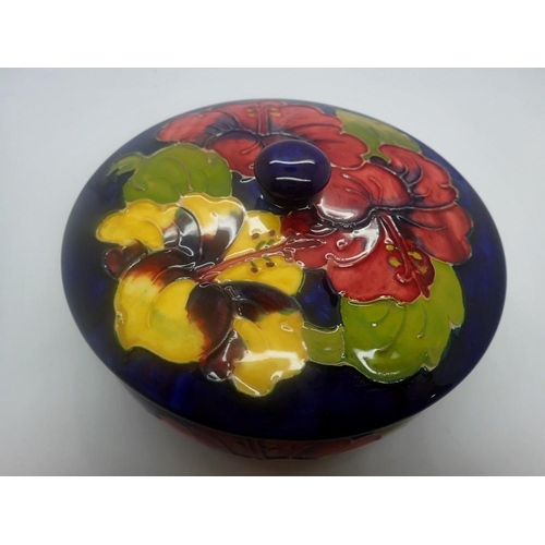 273 - Moorcroft large blue covered pot in the Hibiscus pattern, no chips or cracks, D: 15 cm. UK P&P Group... 