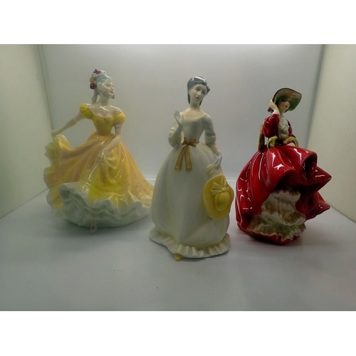 287 - Two Royal Doulton figurines, Nanette and Top O the Hill, and a Royal Worcester figurine, Summertime,... 