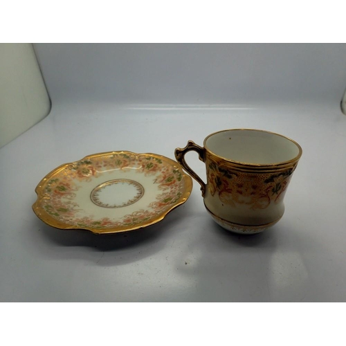 305 - Limoges gilt cup and saucer, small hairline crack to saucer and losses to gilt, D: 13 cm. UK P&P Gro... 