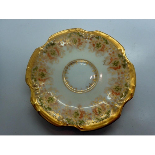 305 - Limoges gilt cup and saucer, small hairline crack to saucer and losses to gilt, D: 13 cm. UK P&P Gro... 