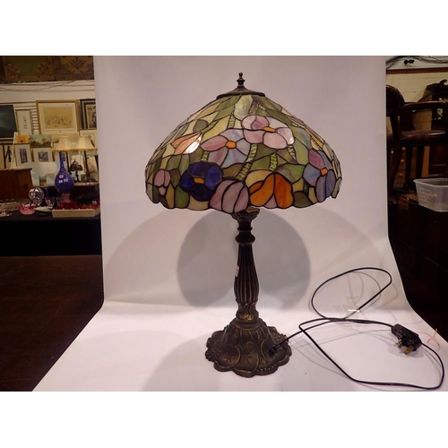 368 - Tiffany style table lamp on a brass base, shade decorated with flowers, H: 63 cm. All electrical ite... 