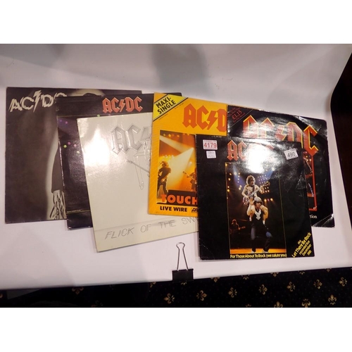 490 - Two AC/DC albums, three 12