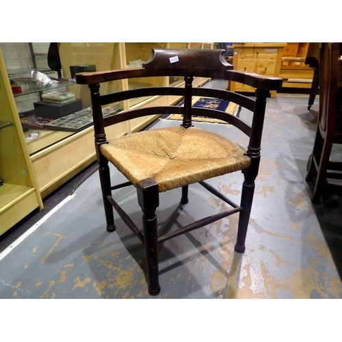 2055 - Oak framed carver chair with rush seat. Not available for in-house P&P