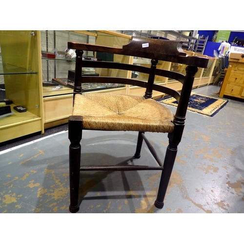 2055 - Oak framed carver chair with rush seat. Not available for in-house P&P