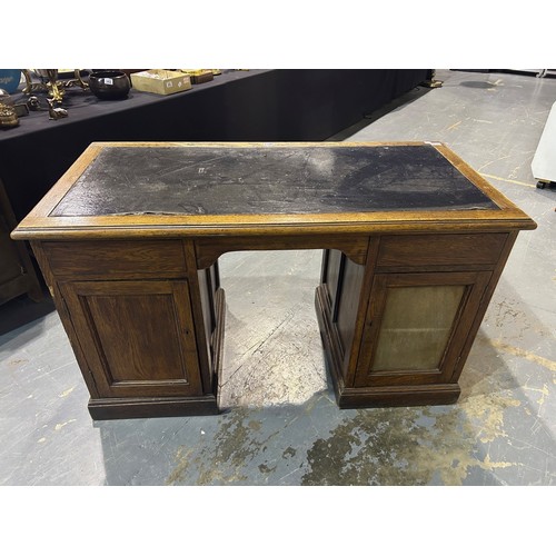 2071 - A Victorian oak twin pedestal partners desk, each side fitted with cupboards, one side with two draw... 