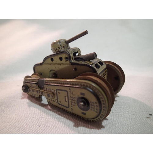 2110 - Gama clockwork sparking tank and a Wells clockwork bus, both good condition, untested, plus diecast ... 