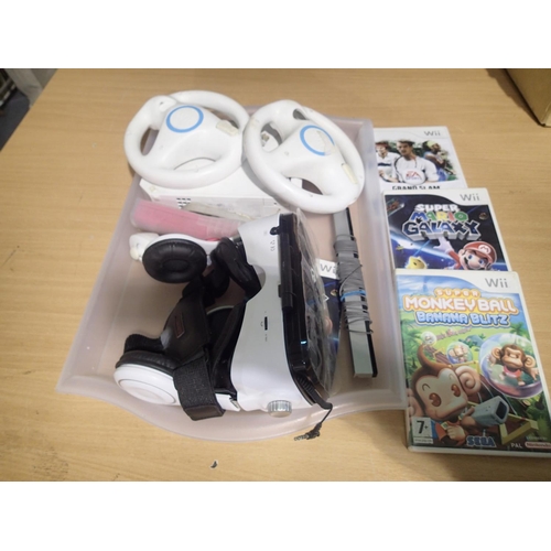 2217 - Nintendo WII, two controllers, wheels, headset, three boxed games and a sensor. No PSU, untested. UK... 