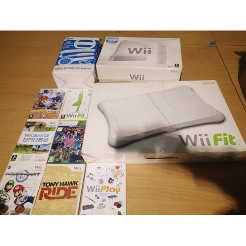 2222 - Nintendo WII with PSU, two pads with extension pads, sensor, TV cables, WII Fit and sports pack, all... 