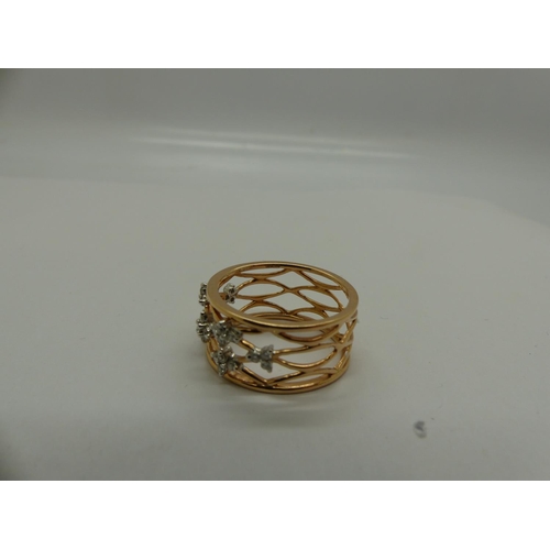 27 - 18ct gold pierced ring set with diamonds, size P/Q, 4.9g. UK P&P Group 0 (£6+VAT for the first lot a... 