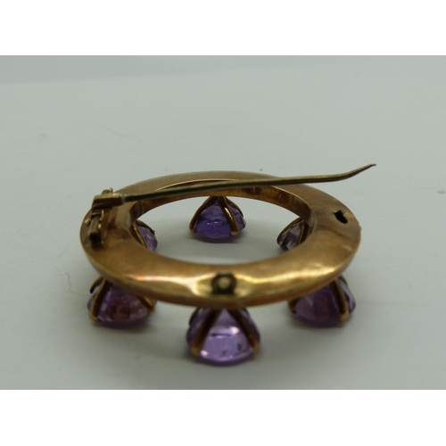 100 - Unmarked gold brooch set with with six large amethysts, lacking pin catch, D: 42 mm, 11.7g. UK P&P G... 