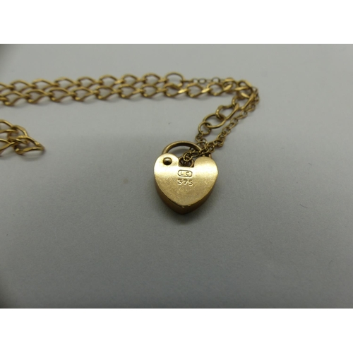 60 - 9ct gold bracelet with padlock clasp and safety chain, L: 24 cm, 2.9g. UK P&P Group 0 (£6+VAT for th... 