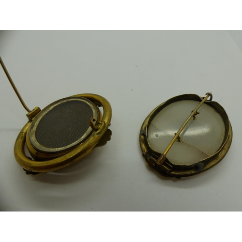 62 - Two yellow metal mounted brooches, one a mourning brooch the other stone set with a cracked stone. U... 