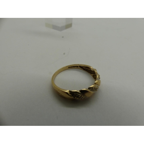 87 - 9ct gold crossover ring set with diamonds, size R, 2.1g. UK P&P Group 0 (£6+VAT for the first lot an... 