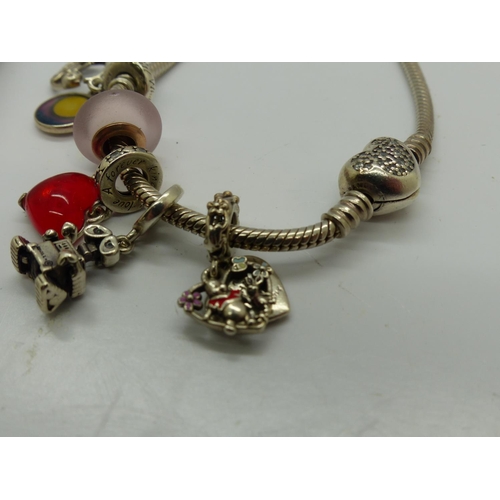 114 - Pandora Disney bracelet with five Disney charms, with box and bag, L: 18 cm. UK P&P Group 1 (£16+VAT... 