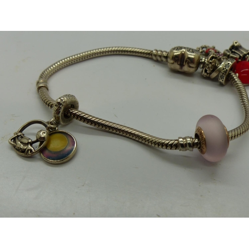 114 - Pandora Disney bracelet with five Disney charms, with box and bag, L: 18 cm. UK P&P Group 1 (£16+VAT... 