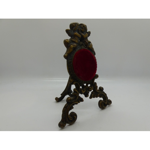 140 - Brass and velour pocket watch stand decorated with cherubs, H: 15 cm. UK P&P Group 1 (£16+VAT for th... 