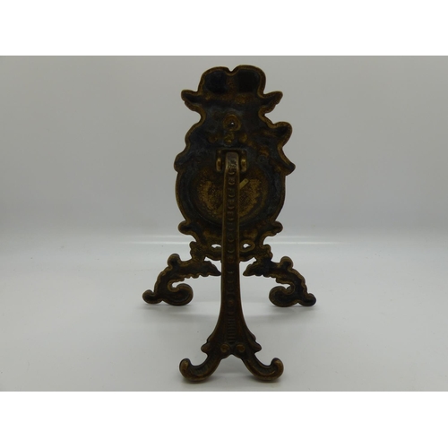 140 - Brass and velour pocket watch stand decorated with cherubs, H: 15 cm. UK P&P Group 1 (£16+VAT for th... 