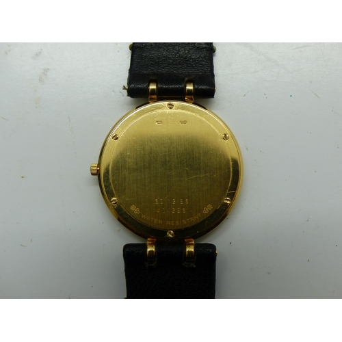 159 - CORUM ROMULUS: 18ct gold cased wristwatch with diamond set bezel on a black leather strap, not worki... 