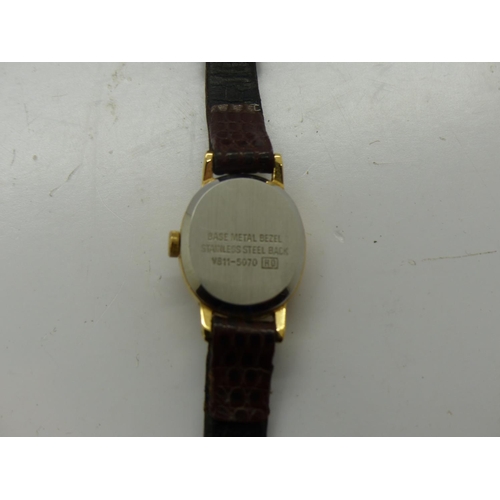 165 - 1990 Lorus Mickey Mouse ex Disney World Florida ladies wristwatch on a brown leather strap, requires... 