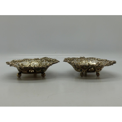 184 - Pair of hallmarked silver pierced and relief decorated bowls, 95 x 80 mm, Birmingham assay, combined... 