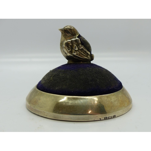 196 - Edwardian hallmarked silver pin cushion by Levi & Salaman, in the form of a seated chick on a circul... 