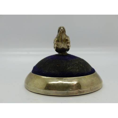 196 - Edwardian hallmarked silver pin cushion by Levi & Salaman, in the form of a seated chick on a circul... 