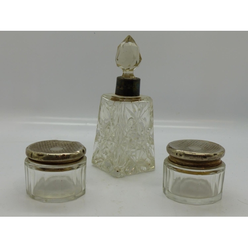 197 - Two hallmarked silver topped jars and a hallmarked silver collared scent bottle. UK P&P Group 2 (£20... 