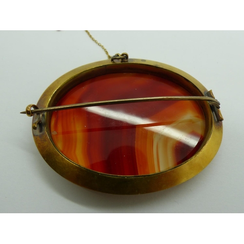 22 - Large Victorian unmarked high-carat gold brooch, set with banded agate, 67 x 55 mm, 35g. UK P&P Grou... 