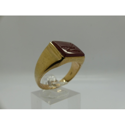 62 - 9ct gold signet ring, set with a carved carnelian intaglio displaying a plough, size U, 7.8g. UK P&P... 