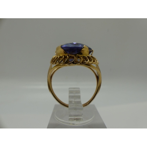 70 - Impressive 14ct gold solitaire ring, set with a large oval-cut sapphire, size M/N, 6.7g, stone 20 x ... 