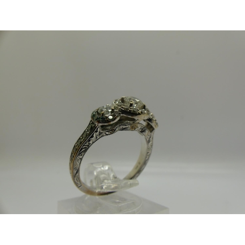 72 - 14ct gold diamond set ring, with central stone (0.25ct) flanked by further diamonds and an aquamarin... 