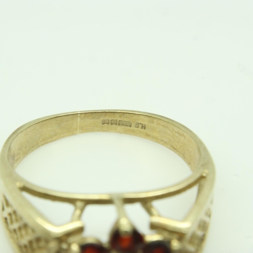 21 - 9ct gold ring set with garnet and topaz. Size K, 2.7g. UK P&P Group 0 (£6+VAT for the first lot and ... 