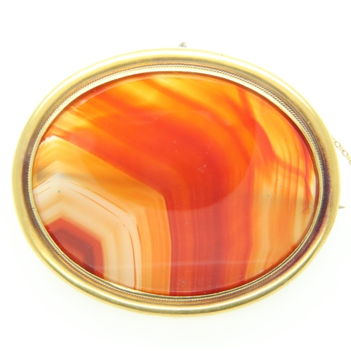 22 - Large Victorian unmarked high-carat gold brooch, set with banded agate, 67 x 55 mm, 35g. UK P&P Grou... 