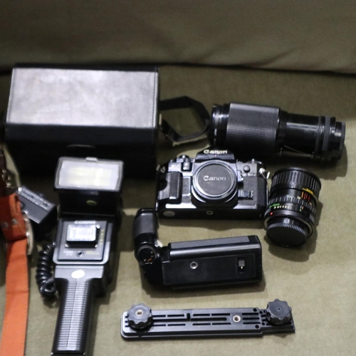 480 - Canon A1 camera, cased, with tripod, two FD lenses, 500 Tamron lens, flash gun and filter set. UK P&... 