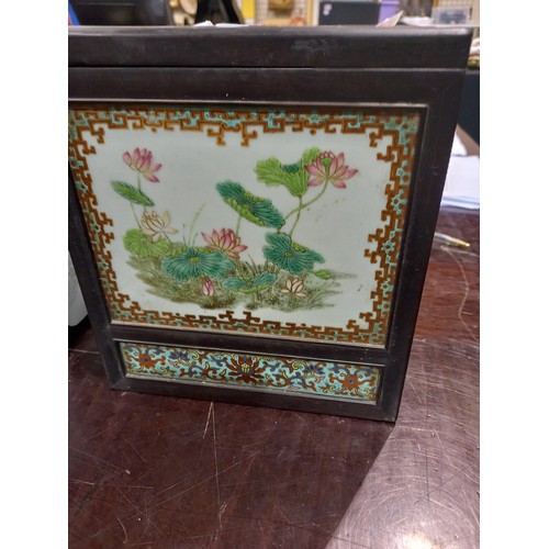 367 - Oriental metal bound tiled box with wooden interior, top tile cracked, 16 x 16 x 20 cm. Crack across... 