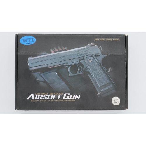 2065 - New old stock airsoft pistol, model V19 in tan, boxed. UK P&P Group 1 (£16+VAT for the first lot and... 