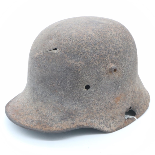 2144 - WWI Battle Damaged German M16 Stahlhelm Helmet. This helmet was found in woodland in the Ypres Salie... 