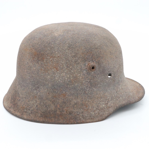 2144 - WWI Battle Damaged German M16 Stahlhelm Helmet. This helmet was found in woodland in the Ypres Salie... 