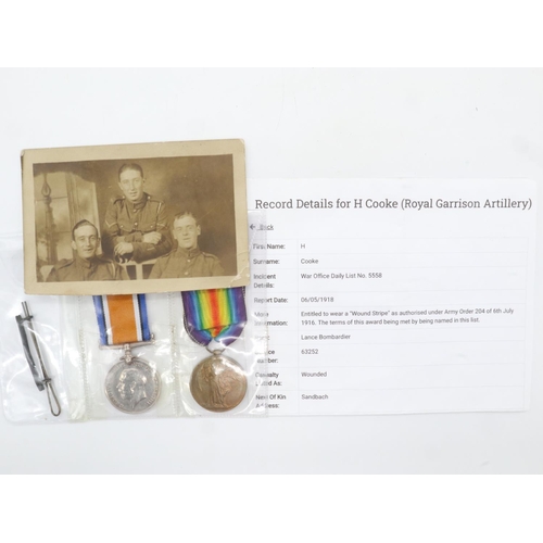 2268 - British WWI medal pair, Wound Stripe and Photograph awarded to: 63252 Bombardier H Cooke Royal Artil... 