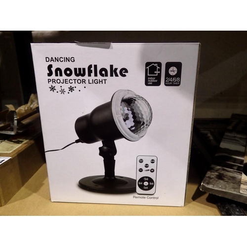1025 - New old stock Dancing Snowflake Projector Light for outdoor and indoor use with remote, boxed, worki... 
