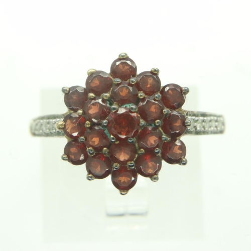 22 - 9ct gold cluster ring set with red stones and diamonds, size P, 2.9g. UK P&P Group 0 (£6+VAT for the... 