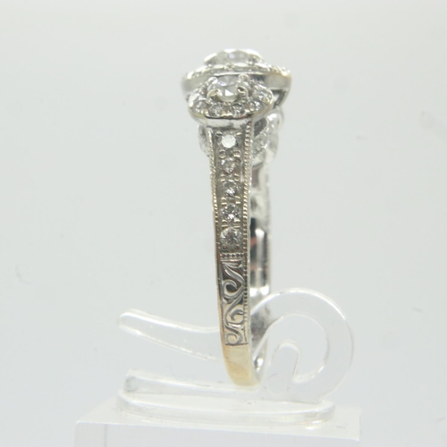 72 - 14ct gold diamond set ring, with central stone (0.25ct) flanked by further diamonds and an aquamarin... 