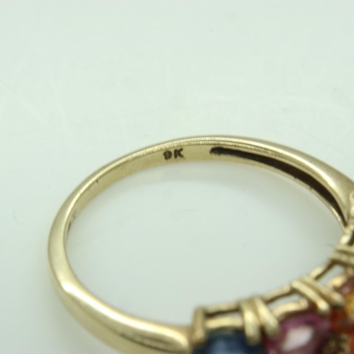 76 - 9ct gold ring set with multi-coloured natural sapphires, size O, 2.6g. UK P&P Group 0 (£6+VAT for th... 
