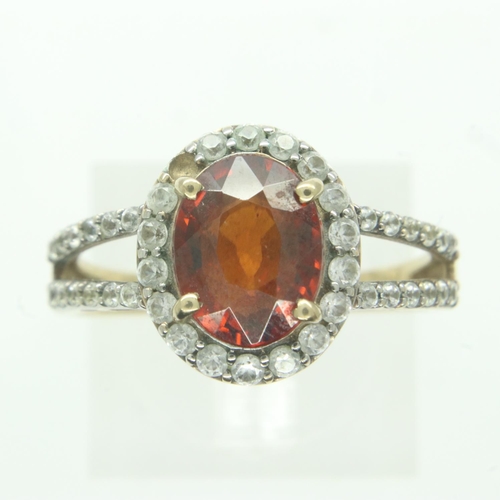 77 - 9ct gold garnet and white stone set ring, size Q, 3.4g. UK P&P Group 1 (£16+VAT for the first lot an... 