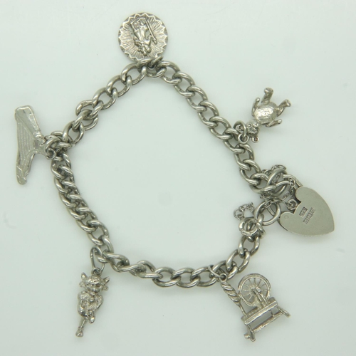 78 - silver charm bracelet with five charms, L: 18 cm, 24g. UK P&P Group 0 (£6+VAT for the first lot and ... 