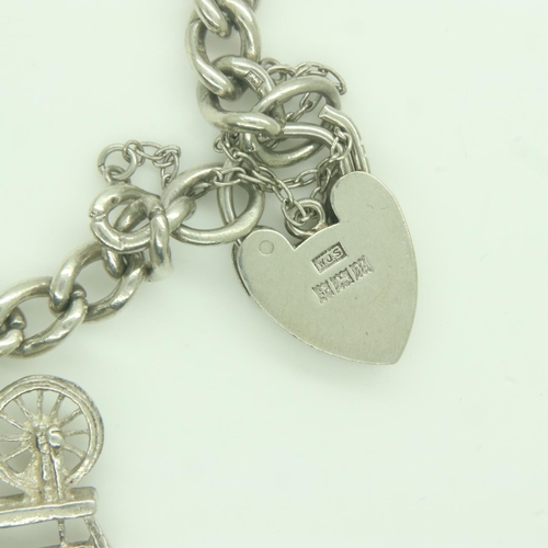 78 - silver charm bracelet with five charms, L: 18 cm, 24g. UK P&P Group 0 (£6+VAT for the first lot and ... 