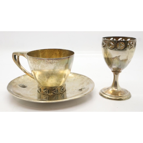 122 - Arts & Crafts 800 silver three piece set, cup, saucer and egg cup, total 102g. Saucer: cleaning abra... 